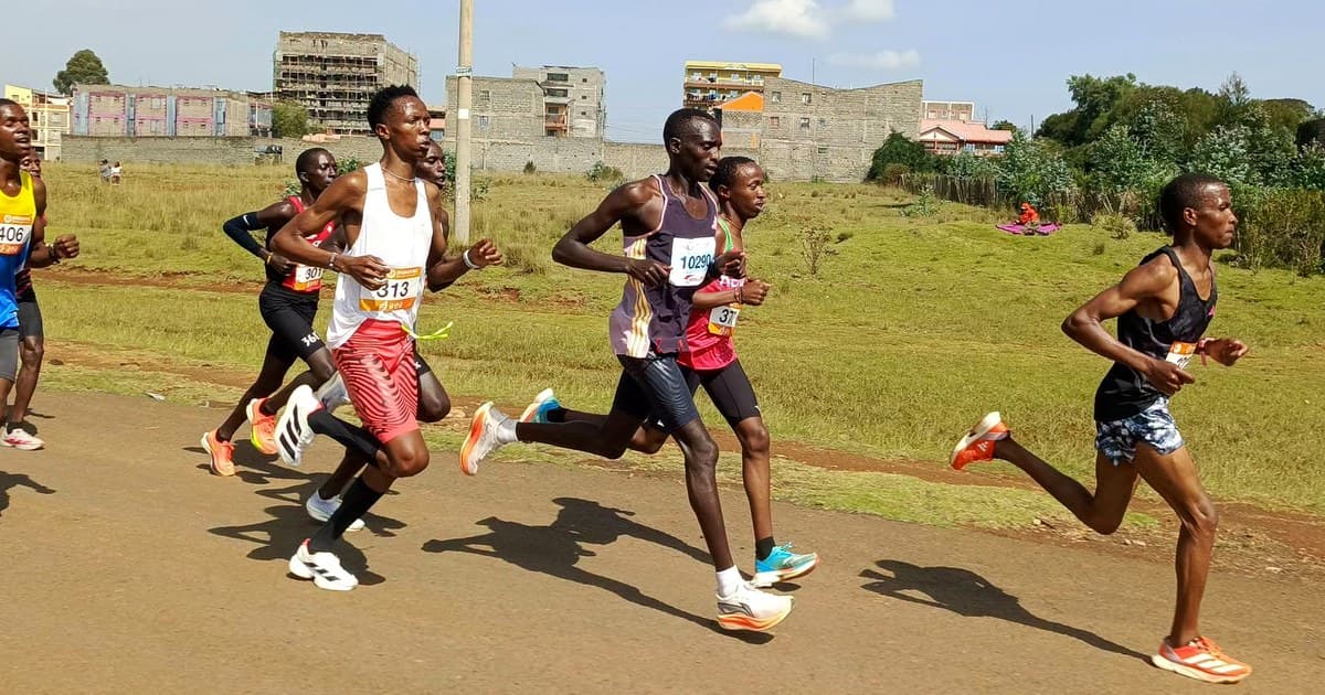 Martin Karoki Muriuki, chest number 313 in a white singlet and red shorts, running in the lead group at the National Marathon Association of Korea 10 km time trial in Nyahururu, August 2026